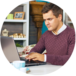 Customer at his computer looking up his order status.